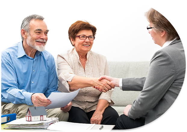 Senior couple signing real estate papers.