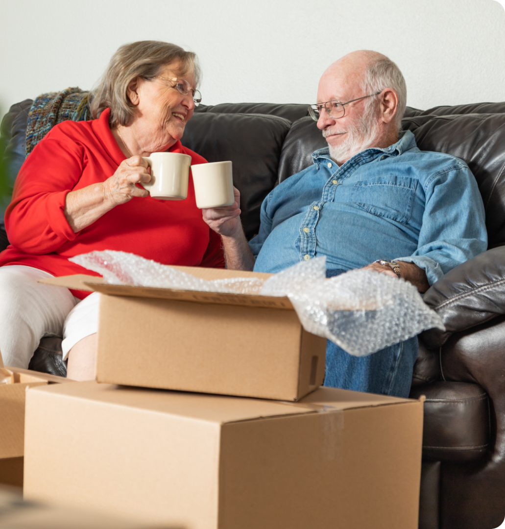 Senior couple enjoying coffee during move.